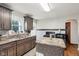 Bright kitchen boasts dark wood cabinets, countertops, and black appliances at 1617 S N St, Elwood, IN 46036
