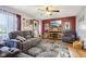 Comfortable living room with large screen television and gray reclining furniture at 1617 S N St, Elwood, IN 46036