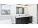 Modern bathroom featuring double sinks and granite countertops at 18203 Sunbrook Way, Westfield, IN 46074