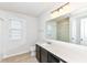 Bathroom with granite countertop, single sink, and large mirror at 18203 Sunbrook Way, Westfield, IN 46074