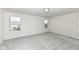 Bright, carpeted bedroom with two windows offering natural light at 18203 Sunbrook Way, Westfield, IN 46074