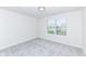 Bright bedroom with neutral carpet, paint, and natural light from one window at 18203 Sunbrook Way, Westfield, IN 46074