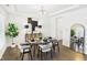 Bright dining room features modern furnishings and decor, including a stylish buffet and lighting at 18203 Sunbrook Way, Westfield, IN 46074