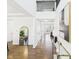 Bright foyer features hardwood floors, a high ceiling and staircase, and modern decor and furnishings at 18203 Sunbrook Way, Westfield, IN 46074