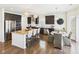 Spacious kitchen featuring an island, stainless steel appliances, dark cabinets, and an adjacent dining area at 18203 Sunbrook Way, Westfield, IN 46074