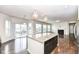 Open kitchen featuring granite countertops, a large island, stainless appliances, and hardwood floors at 18203 Sunbrook Way, Westfield, IN 46074