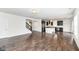 Spacious living room and kitchen with stainless steel appliances and beautiful hardwood floors at 18203 Sunbrook Way, Westfield, IN 46074