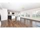 Open floor plan featuring hardwood floors, a kitchen, dining area, and living room at 18203 Sunbrook Way, Westfield, IN 46074