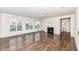 Light-filled living room featuring hardwood floors and a fireplace at 18203 Sunbrook Way, Westfield, IN 46074
