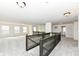 Loft area with neutral walls, carpet, and black wrought iron railings at 18203 Sunbrook Way, Westfield, IN 46074