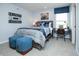 Stylish bedroom with sports themed decor, a comfortable bed, and a well-lit desk area at 20342 Hudson Bay Ln, Westfield, IN 46074