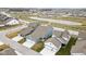 Aerial view of single-Gathering homes, garages, a pond and tree-lined streets in a Gathering-friendly neighborhood at 2156 W 171St St, Westfield, IN 46074