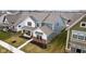 This blue two-story home features a covered porch, brick accents, and a well-maintained yard at 2156 W 171St St, Westfield, IN 46074