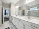 Bright bathroom with dual sinks, quartz counters, and a glass-enclosed marble shower at 2156 W 171St St, Westfield, IN 46074