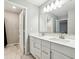 Bright bathroom with double vanity, quartz countertop, white cabinets, and modern lighting at 2156 W 171St St, Westfield, IN 46074