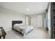 Cozy bedroom boasts neutral walls, carpeted floor, and a double window for natural light at 2156 W 171St St, Westfield, IN 46074