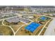Aerial view of a community center with a pool, tennis courts, clubhouse, and parking at 2156 W 171St St, Westfield, IN 46074