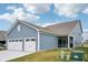 Charming two-car garage complements the blue exterior of this well-maintained home at 2156 W 171St St, Westfield, IN 46074