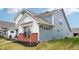 Side view of a two-story home featuring brick accents and blue siding at 2156 W 171St St, Westfield, IN 46074