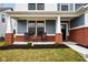 Inviting front porch with seating, brick columns, and a view of the entrance at 2156 W 171St St, Westfield, IN 46074
