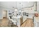 Open kitchen featuring a large island with bar seating and modern appliances at 2156 W 171St St, Westfield, IN 46074