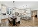 Modern kitchen with a large island, stainless steel appliances, and pendant lighting at 2156 W 171St St, Westfield, IN 46074