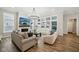 Spacious living room featuring a fireplace, large windows, and modern decor at 2156 W 171St St, Westfield, IN 46074