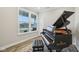 Living room with a piano and large window at 2156 W 171St St, Westfield, IN 46074