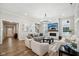 Bright and airy living room with hardwood floors, fireplace, and modern chandelier at 2156 W 171St St, Westfield, IN 46074
