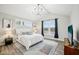 Bright bedroom with vaulted ceilings, chandelier, and large windows overlooking the neighborhood at 2156 W 171St St, Westfield, IN 46074