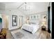 Bright main bedroom featuring vaulted ceiling, modern chandelier, and neutral décor at 2156 W 171St St, Westfield, IN 46074