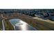 Community aerial view showcasing a pond with fountain feature and walking trails throughout the neighborhood at 2208 Gambel Ln, Danville, IN 46122