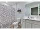 Well-lit bathroom with white vanity, framed mirror, and patterned shower curtain at 2208 Gambel Ln, Danville, IN 46122