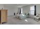 Spacious bedroom with carpet, two windows, and a light green bedspread at 2208 Gambel Ln, Danville, IN 46122