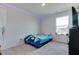 Bedroom with a bed, carpet, window, and a basketball hoop on the wall for recreational fun at 2208 Gambel Ln, Danville, IN 46122
