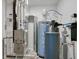Mechanical room featuring a furnace, water heater, and filtration system at 2208 Gambel Ln, Danville, IN 46122