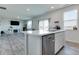 Open kitchen featuring an island with bar seating, stainless steel appliances, and wood-look flooring at 2208 Gambel Ln, Danville, IN 46122