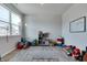 Bright playroom with light gray floors, a large window and a variety of toys at 2208 Gambel Ln, Danville, IN 46122