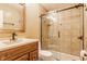 Bathroom with wood vanity, sink, and glass door shower at 2605 Rollins Ct, Indianapolis, IN 46268