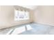 Comfortable bedroom featuring a large window providing ample natural light and neutral carpeting at 2605 Rollins Ct, Indianapolis, IN 46268