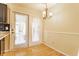 Dining area with double doors and white curtains at 2605 Rollins Ct, Indianapolis, IN 46268