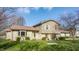 Charming split-level home featuring stone accents and manicured front lawn, perfect for curb appeal at 2605 Rollins Ct, Indianapolis, IN 46268