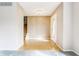 Bright foyer featuring hardwood floors and staircase leading to the upper level, offering a welcoming entrance at 2605 Rollins Ct, Indianapolis, IN 46268