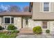 Inviting front entrance with decorative glass door, stone accents, and tiled steps, creating a warm welcome at 2605 Rollins Ct, Indianapolis, IN 46268
