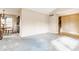 Spacious living room featuring neutral carpet, ample natural light, and views into the adjacent dining area at 2605 Rollins Ct, Indianapolis, IN 46268