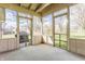 Screened-in porch with a carpeted floor and screened windows, with a view of the yard at 2605 Rollins Ct, Indianapolis, IN 46268