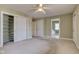 Spacious bedroom with closet, ensuite bathroom, and ceiling fan at 2620 Central Ave, Indianapolis, IN 46205