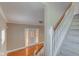Inviting foyer with hardwood floors, staircase, and decorative front door at 2620 Central Ave, Indianapolis, IN 46205