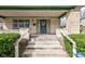 Close-up of the home's porch stairs, showcasing the entrance and surrounding greenery at 2620 Central Ave, Indianapolis, IN 46205