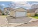 A two-car garage at the back of the house with a driveway and lighting at 2620 Central Ave, Indianapolis, IN 46205